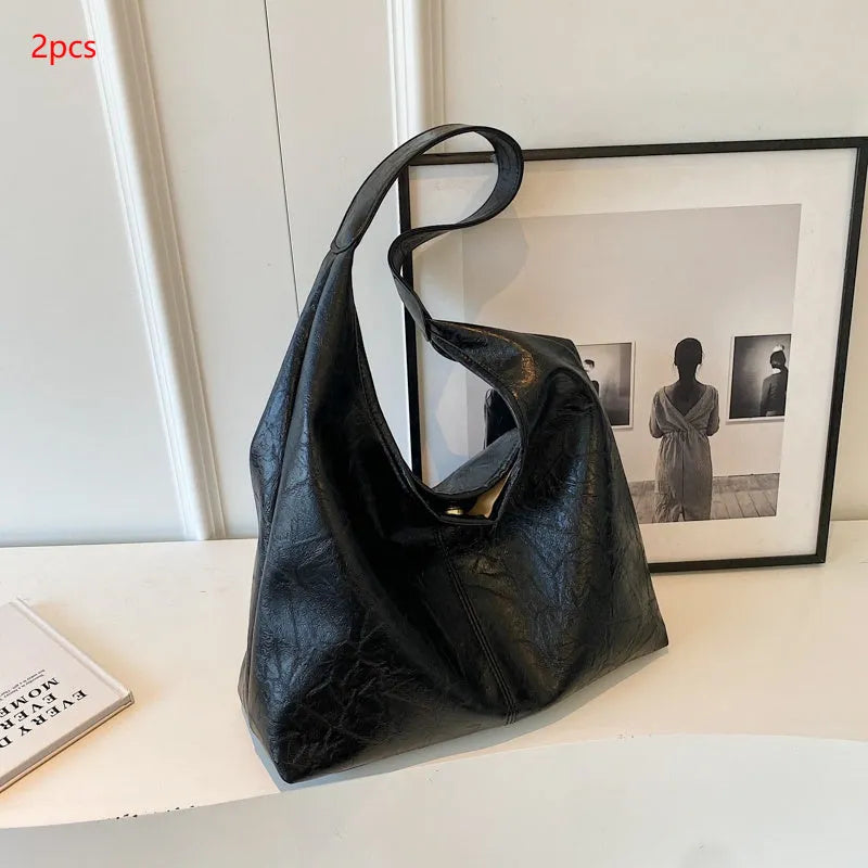 Casual soft leather shoulder bag with sandwich pockets in various colour options