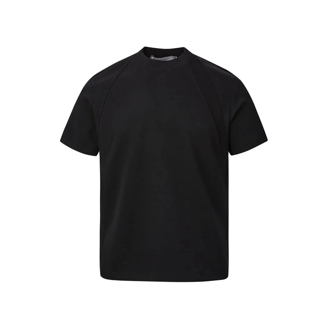 Man wearing a black loose-fit short sleeve top with visible air layer stitching texture.