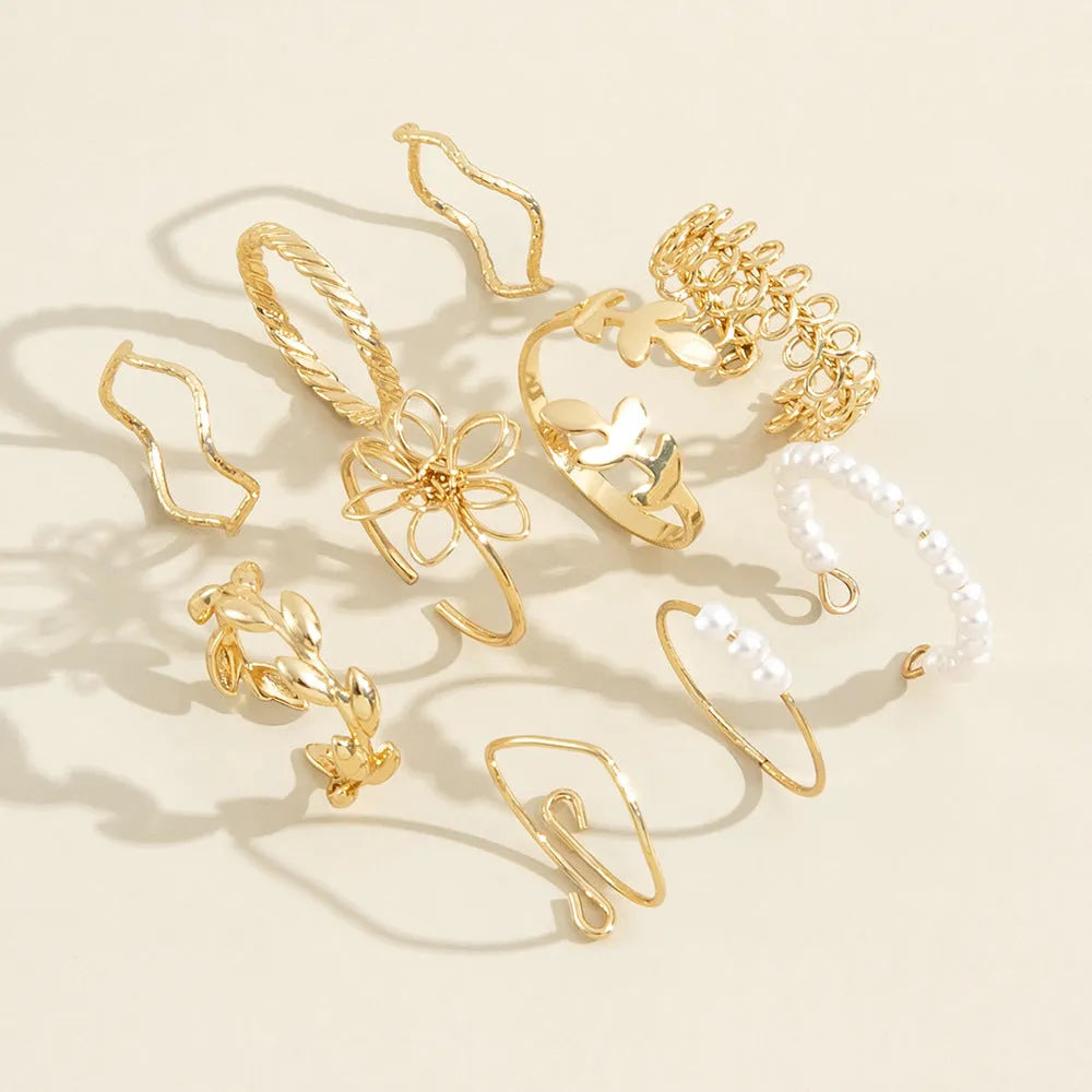 Gold-coloured openwork flower ring set for women with electroplated finish and floral design