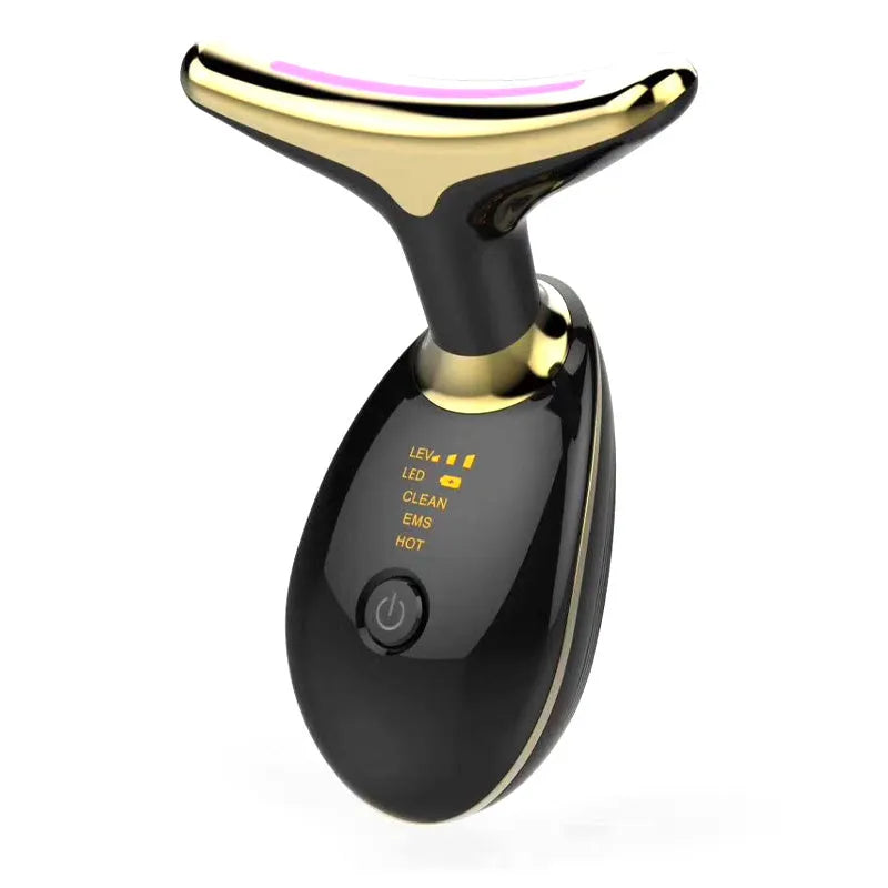 White EMS thermal neck massager with LED lights, shown with USB cable and moisturiser box
