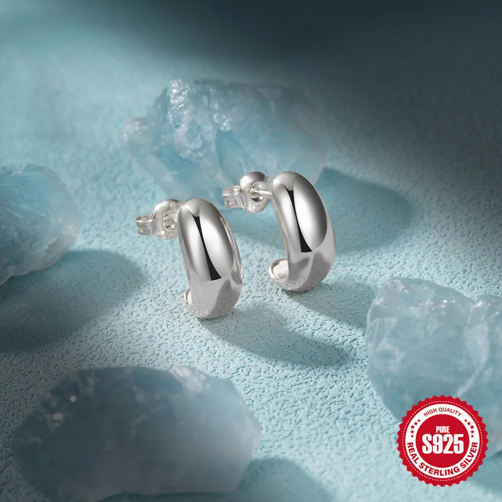 Sterling silver C-shaped stud earrings with electroplated gold finish