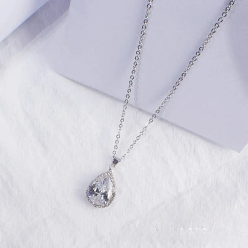 Rose gold pink drop shape women's necklace with geometric rhinestone detailing and alloy construction
