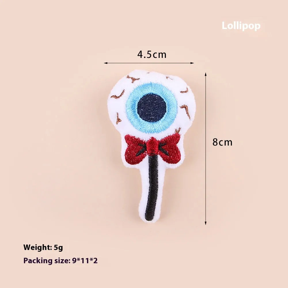 Handheld plush cat teaser toy with candy design on small wand for interactive play