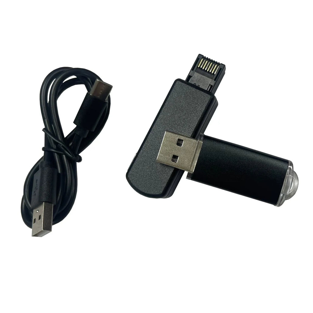 Black JB Tool USB gaming adapter with alloy construction next to its data cable and user manual.