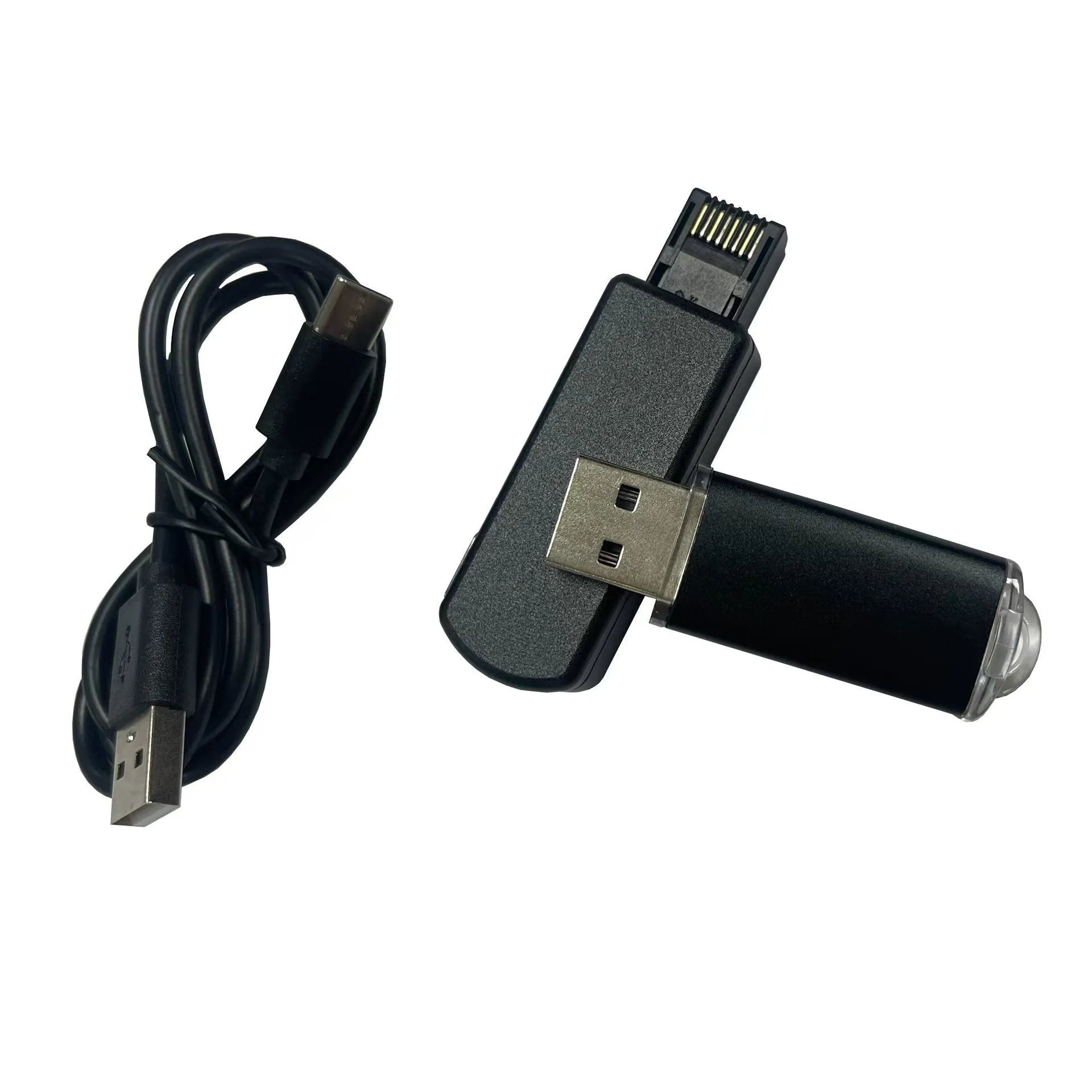 Black JB Tool USB gaming adapter with alloy construction next to its data cable and user manual.