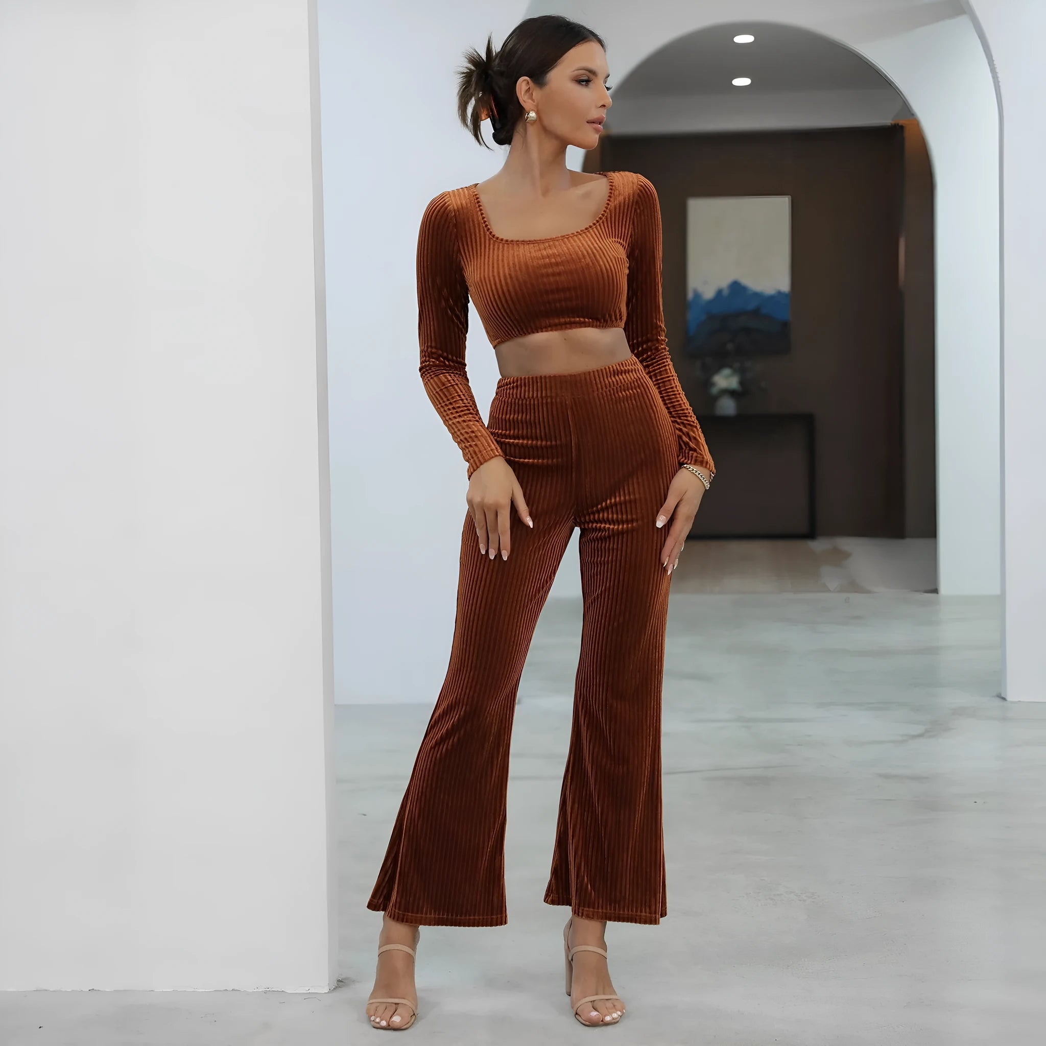 Caramel coloured women's long sleeve sweater and matching trousers casual two-piece set.