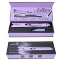 Mini hair straightener with steam spray function in rose red colour on a white background.
