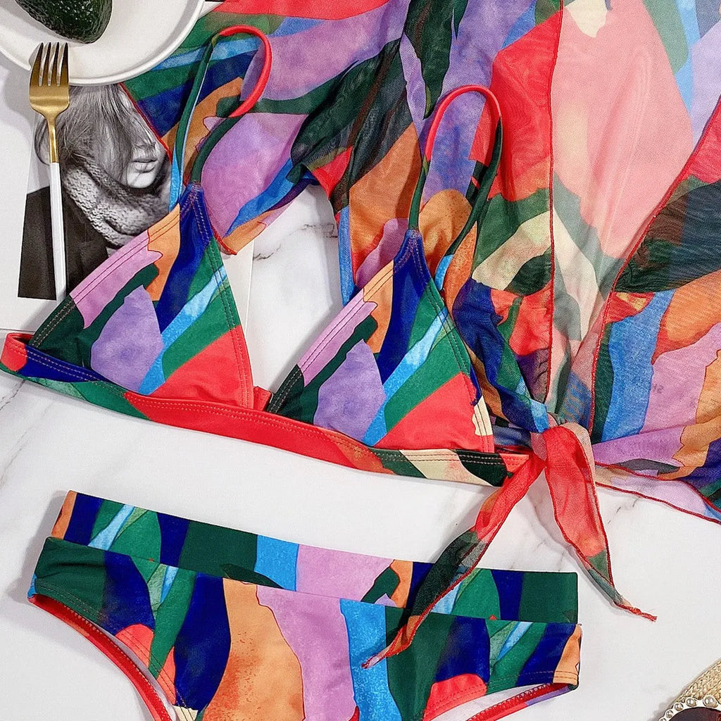 Red women's printed split swimsuit bikini made from nylon fabric.