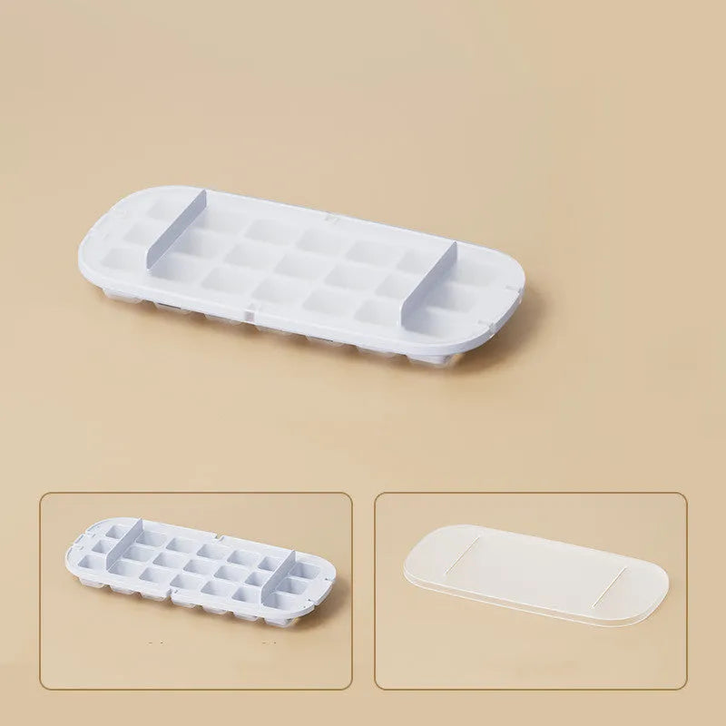 Blue high-capacity ice cube tray with integrated storage for an ice shovel.
