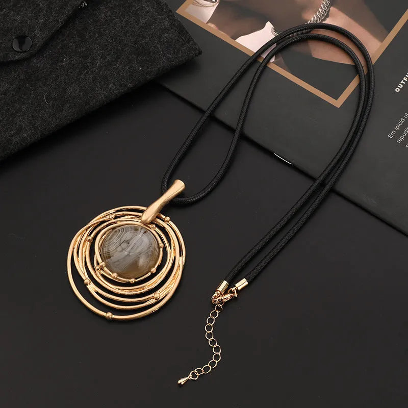 Gold tone geometric pendant necklace with snake chain for women, adjustable up to 80cm.