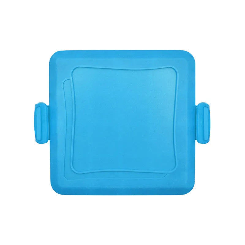 Red silicone baking tray with matching heat-resistant gloves on a kitchen counter.