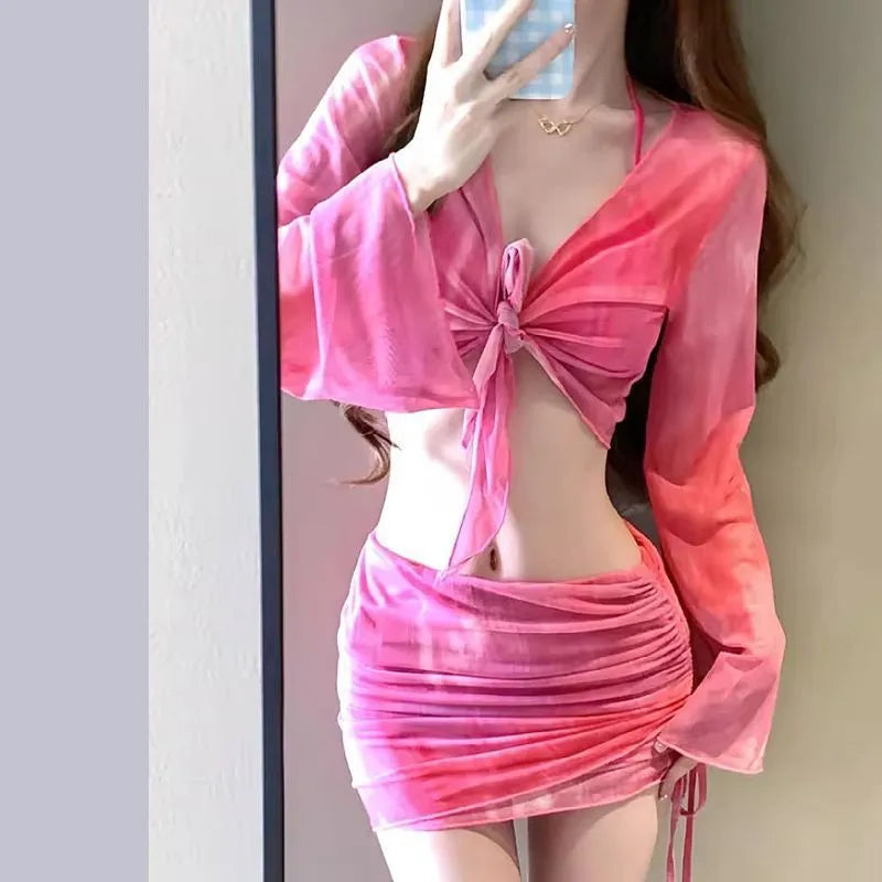 Women's four-piece high waist bikini set in blue and pink with skirt and backless top
