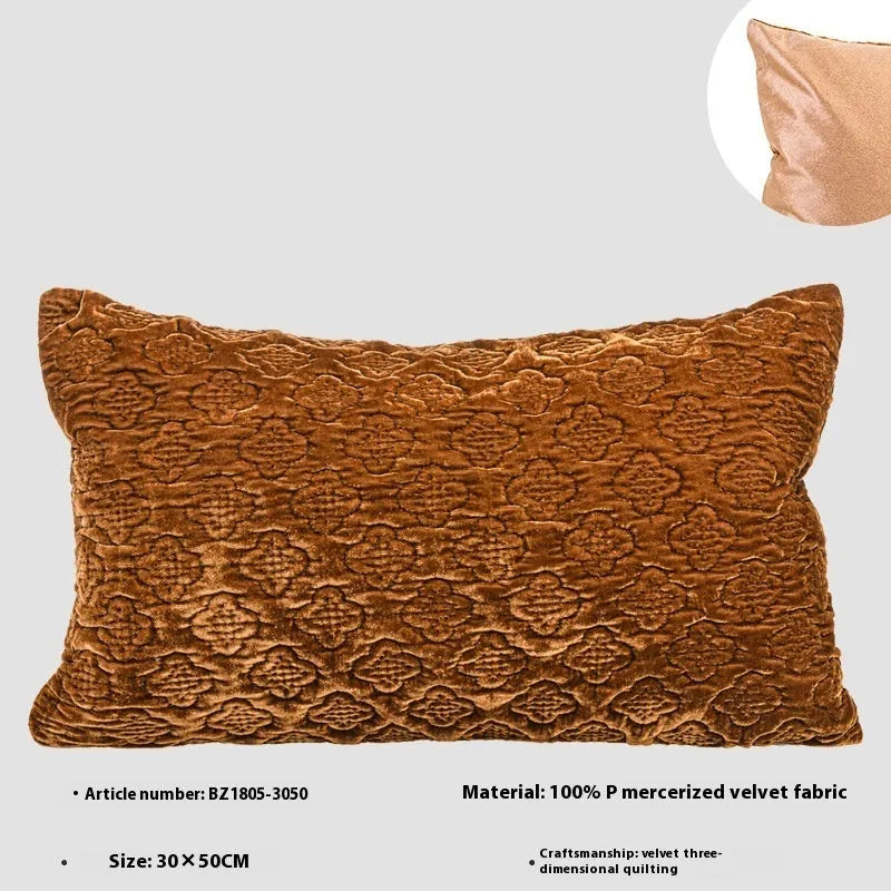 Brown gold antique-style three-dimensional quilted cushion pillow on a sofa