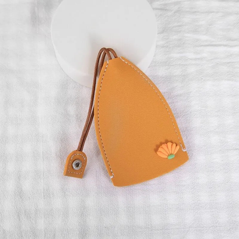 Cartoon pull-out key case in PU leather with colourful design, showing compact 14cm by 7.5cm dimensions