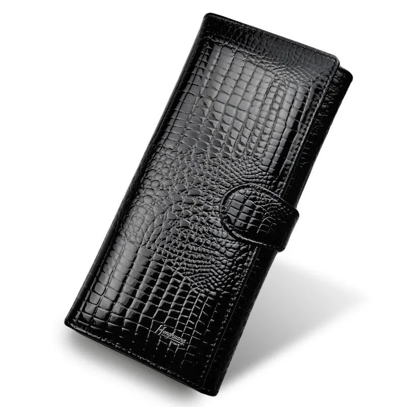 Wine red women's leather coin purse with a shiny crocodile pattern texture and open interior.