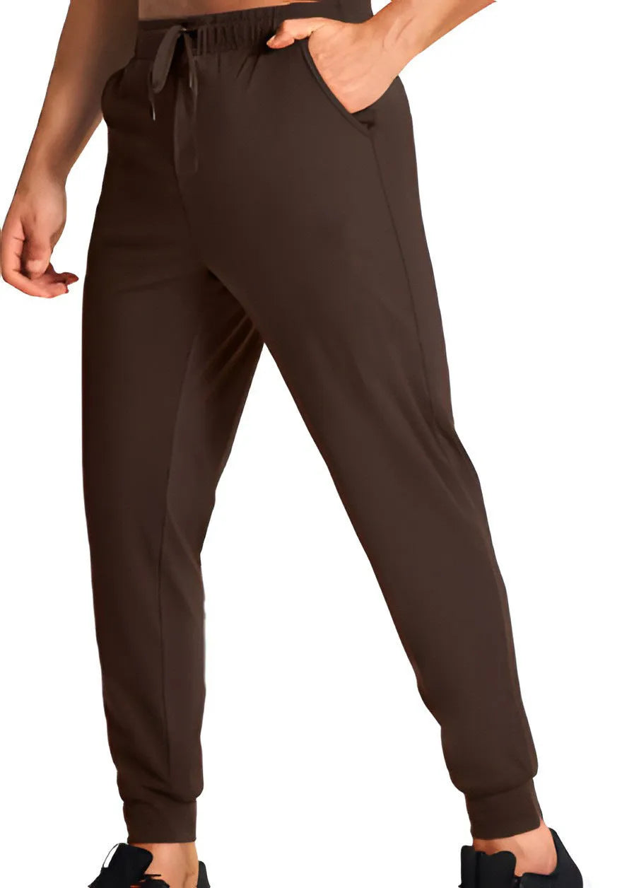 Men's loose-fit solid colour casual trousers on a hanger, showing the relaxed leg cut.