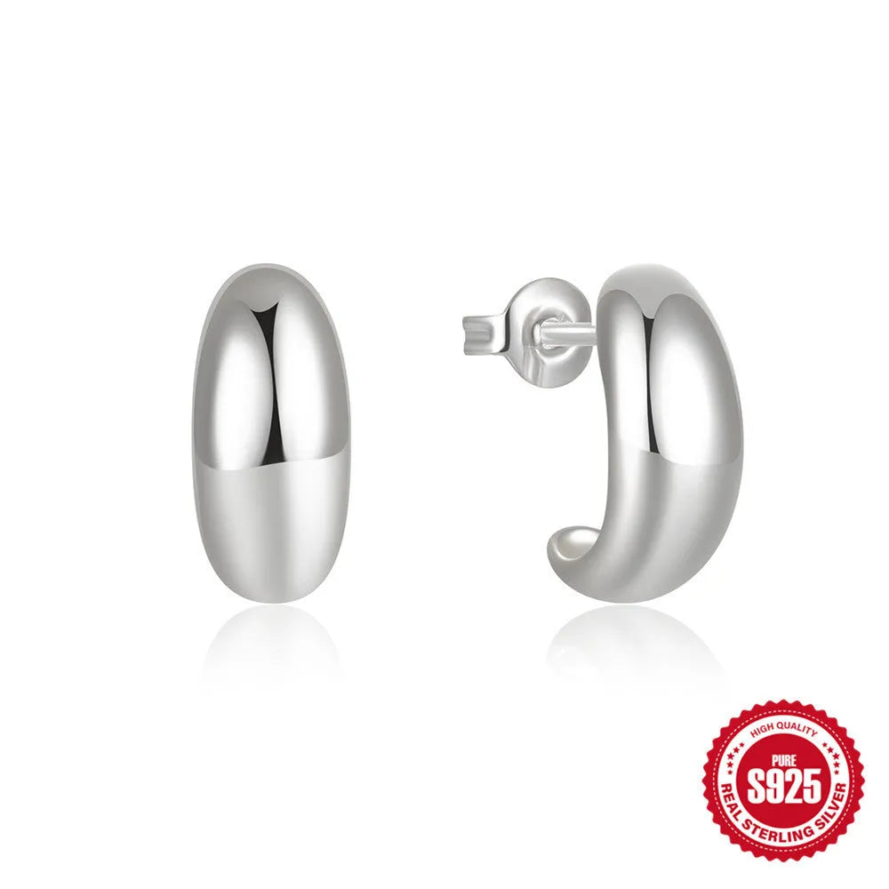 Sterling silver C-shaped stud earrings with electroplated gold finish