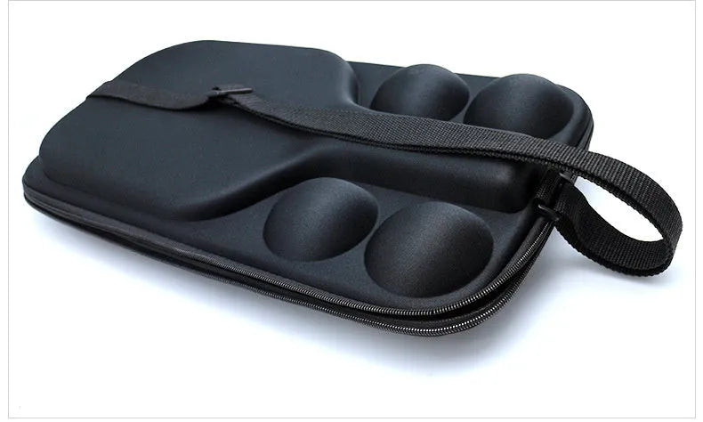 Black waterproof pickleball storage bag with two shoulder straps, showing size relative to a racket and balls.