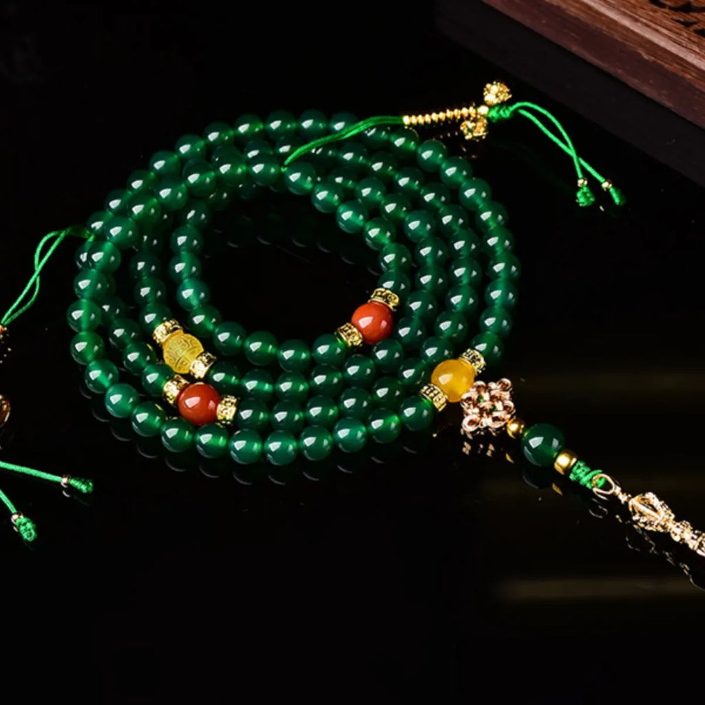 Handmade green agate multi-strand bracelet for men and women on a white background.