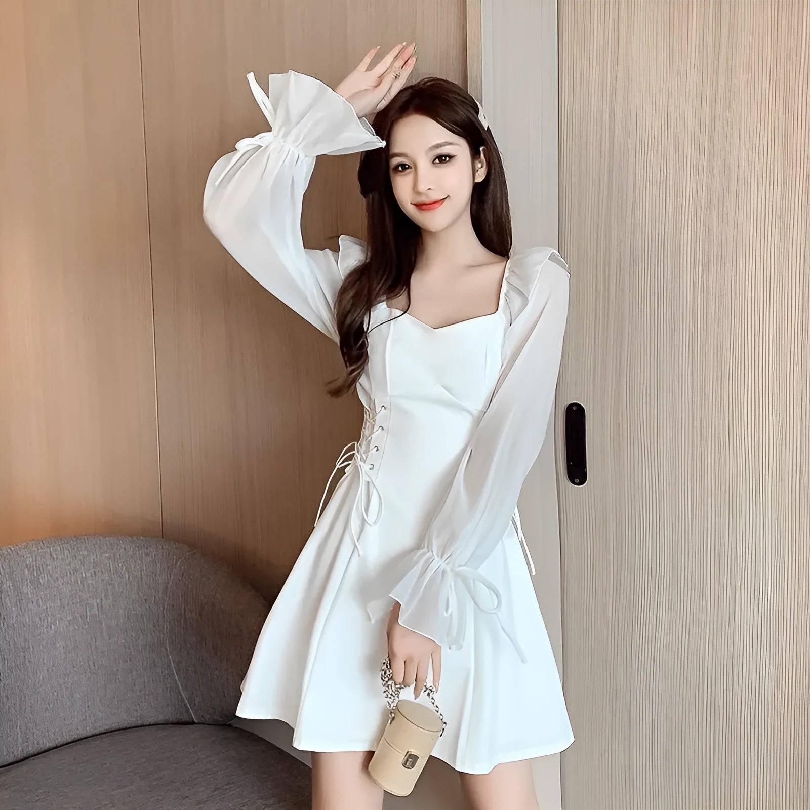 White women's long sleeve maxi dress with patchwork detail and a fitted waist.