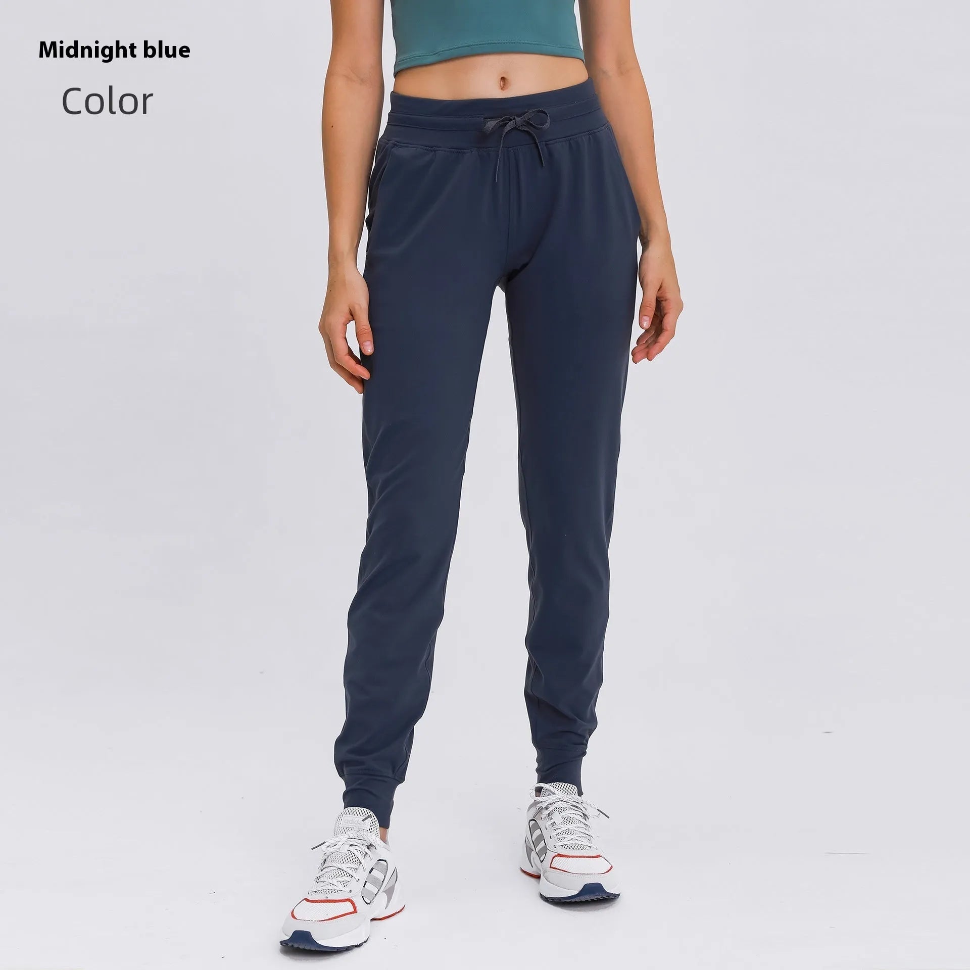 Women's high-waist yoga pants with drawstring waistband in a cotton blend fabric.