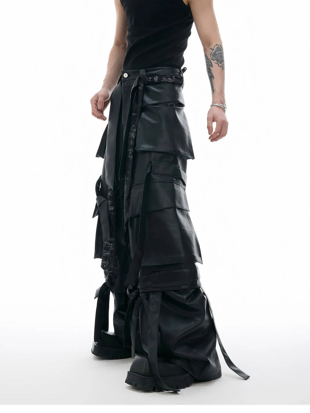 Black loose-fit retro leather-look pants with quilted texture and multi-pocket stitching detail.