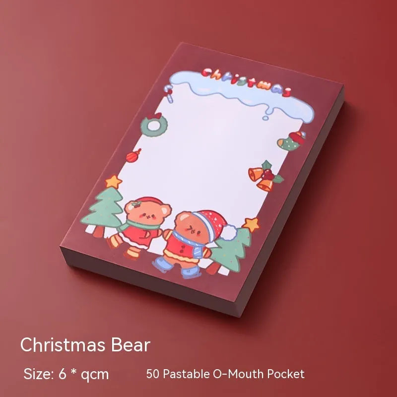 Christmas sticky notes book showing cartoon designs of Elf, Gift, Sled, Ball, Santa, House, Bear, and Snowman