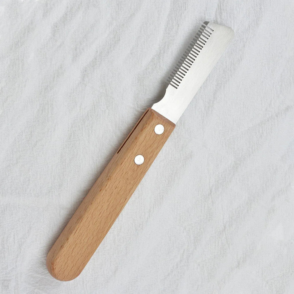 Pet grooming comb with wood handle and metal teeth for removing floating hair from dogs and cats