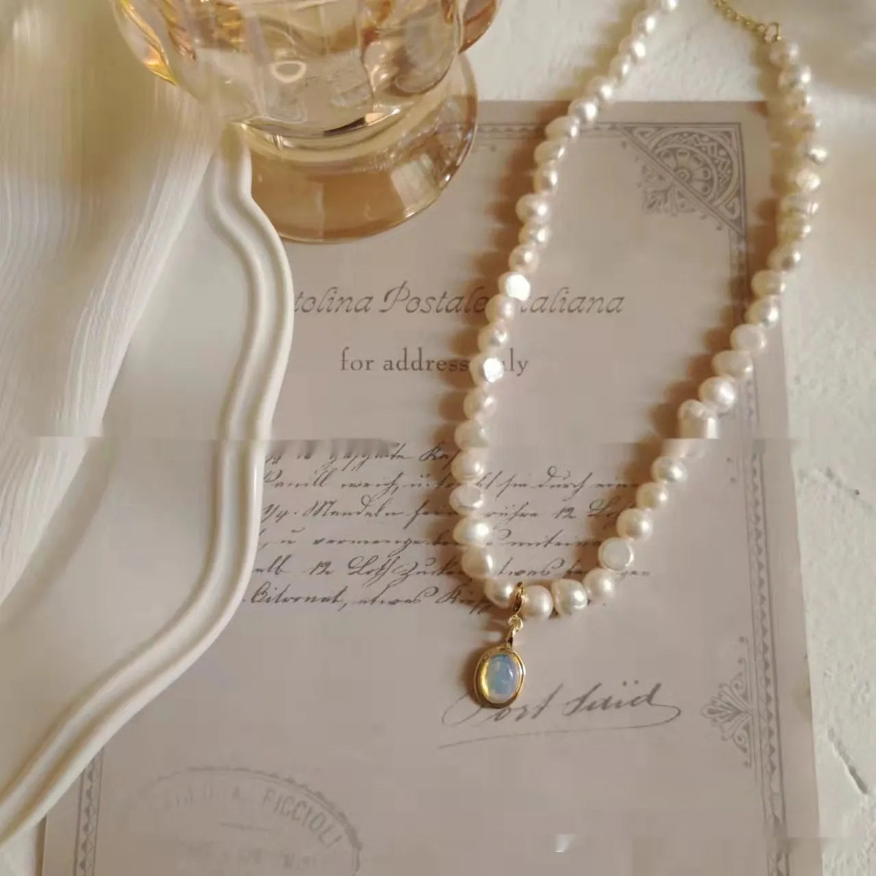 French court vintage style necklace with geometric alloy pendant and pearls on an adjustable chain.