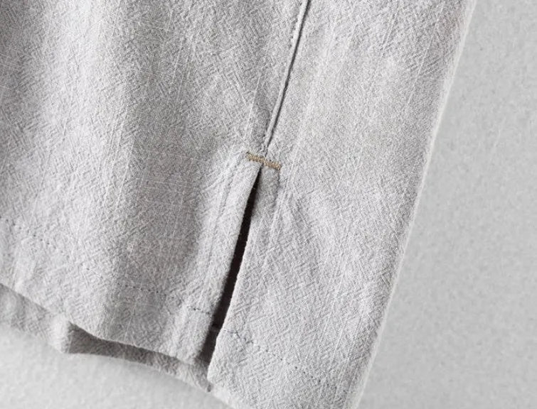 Man wearing a loose fit, light grey linen casual shirt.