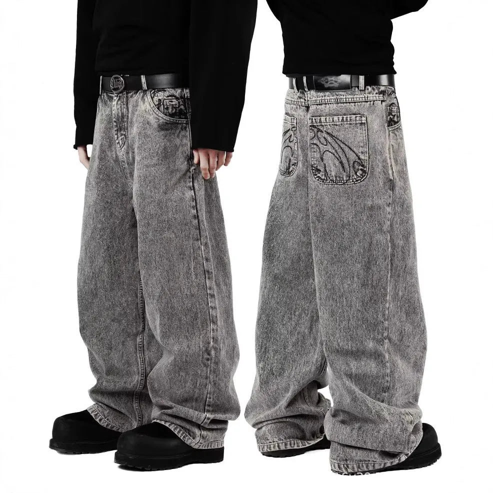 Grey loose-fitting straight-leg cotton denim trousers for men and women on a hanger