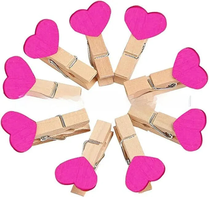 Pack of five solid wood heart-shaped clips in assorted colours on a white background.