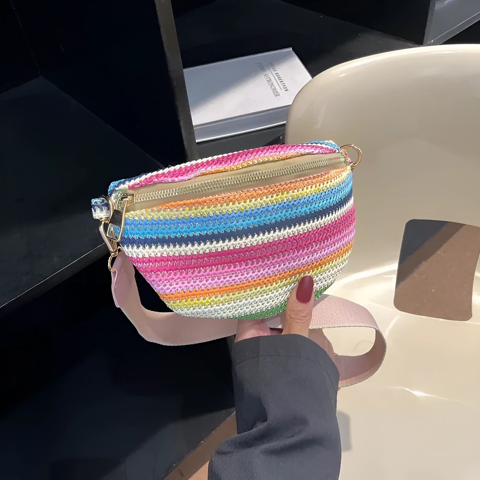 Bohemian style straw woven women's shoulder bag with adjustable strap in pink colour