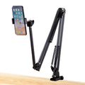 Black foldable metal cantilever bracket holding a tablet on a desktop, showing adjustable arms and clamp.
