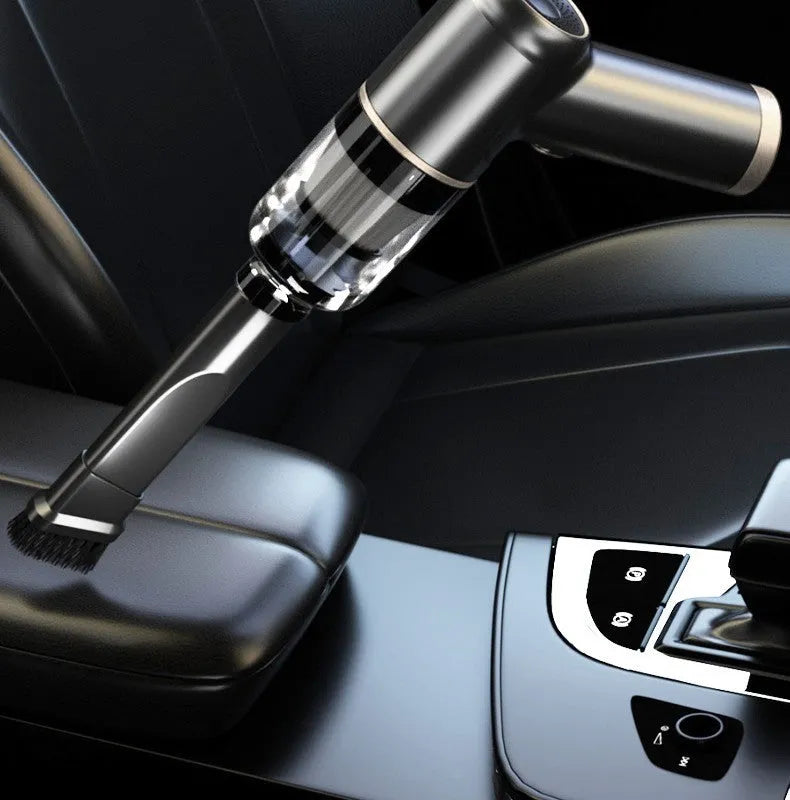 Black wireless handheld car vacuum cleaner with multiple nozzle attachments on a black background