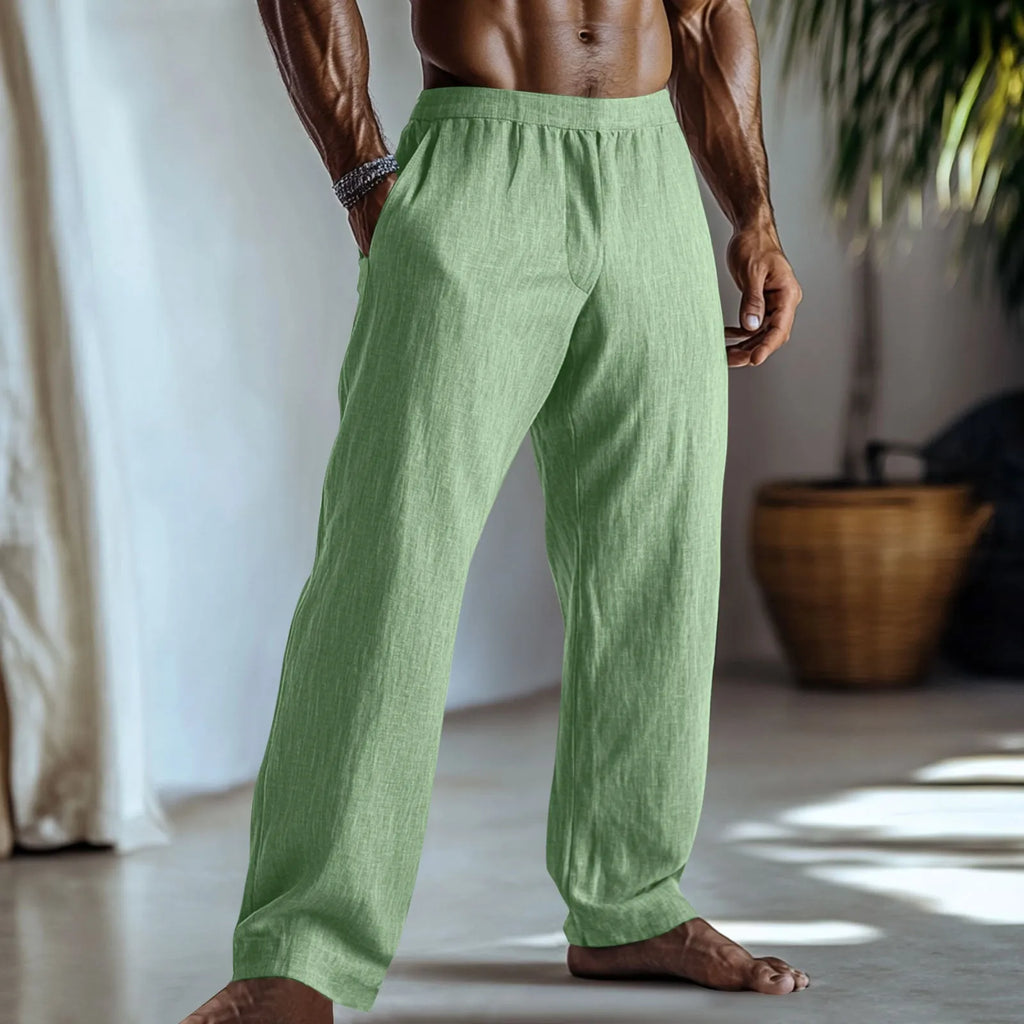 Straight-leg casual trousers in cotton and linen fabric, shown in a light green colour with visible side pockets.
