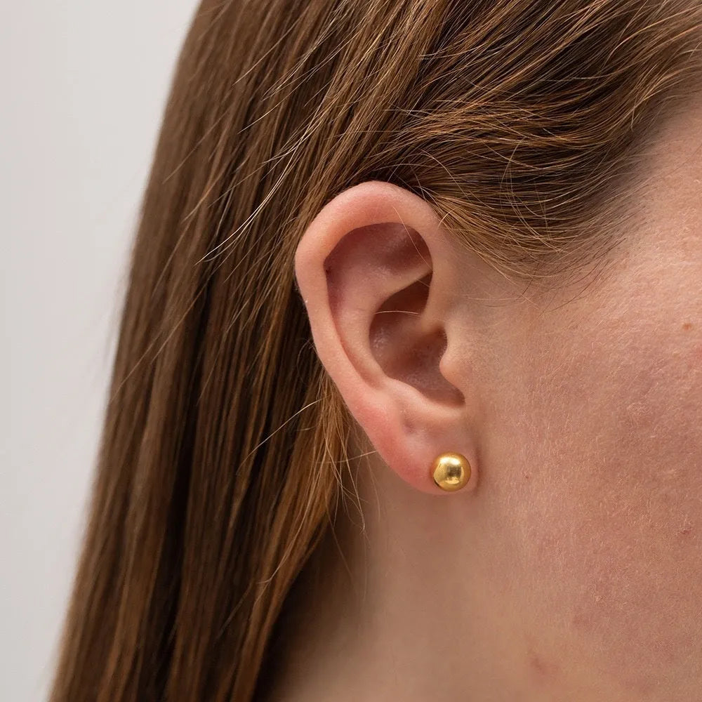 Stainless steel ball stud earrings showing 3mm, 4mm, 5mm, and 6mm sizes with gold and silver finishes