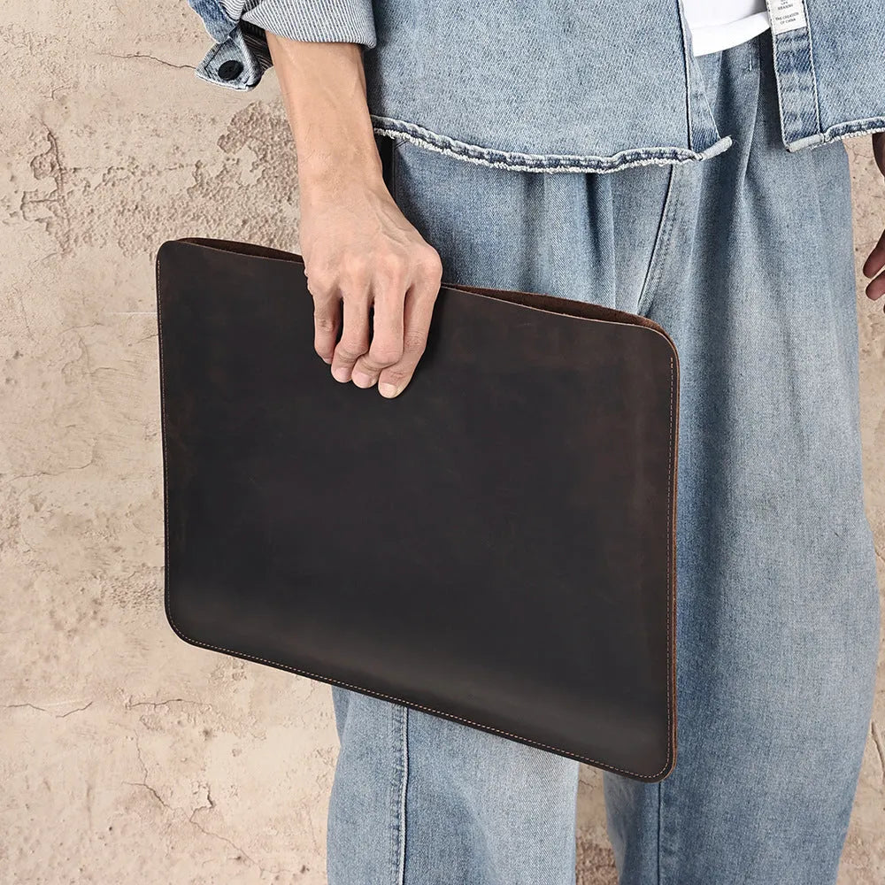 Men's brown crazy horse leather horizontal computer liner bag showing compartments and wear-resistant construction