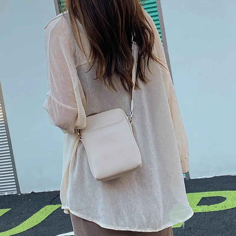 Small solid-colour PU crossbody shoulder bag for mobile phone.