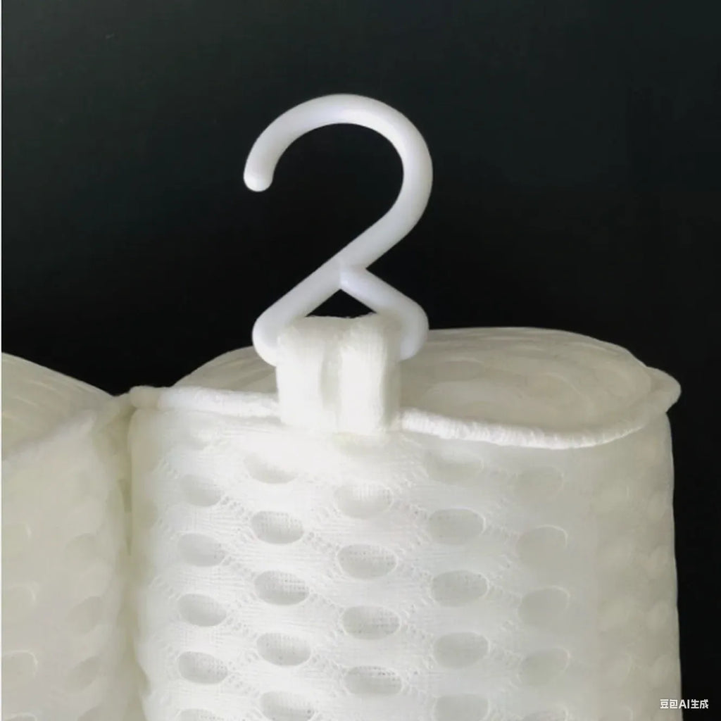 White 3D mesh bathtub pillow with seven suction cups on a bathtub.