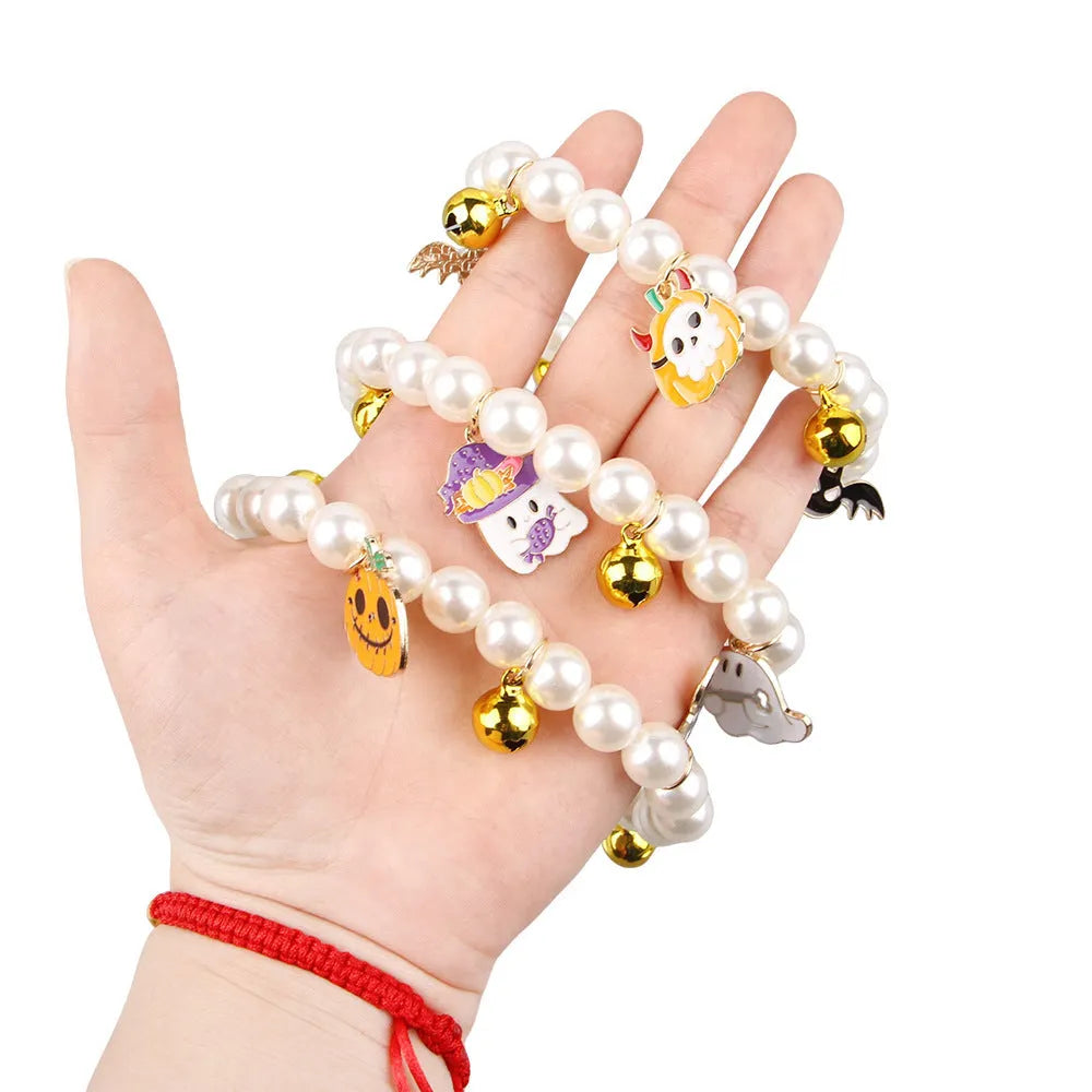 Purple simulated pearl Halloween cat collar decoration with a choice of ghost or pumpkin pendants.