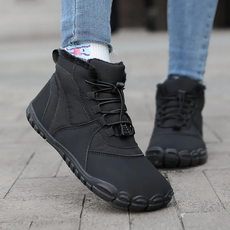 A pair of waterproof fleece-lined outdoor snow boots with a round toe, front laces, and a rubber sole.