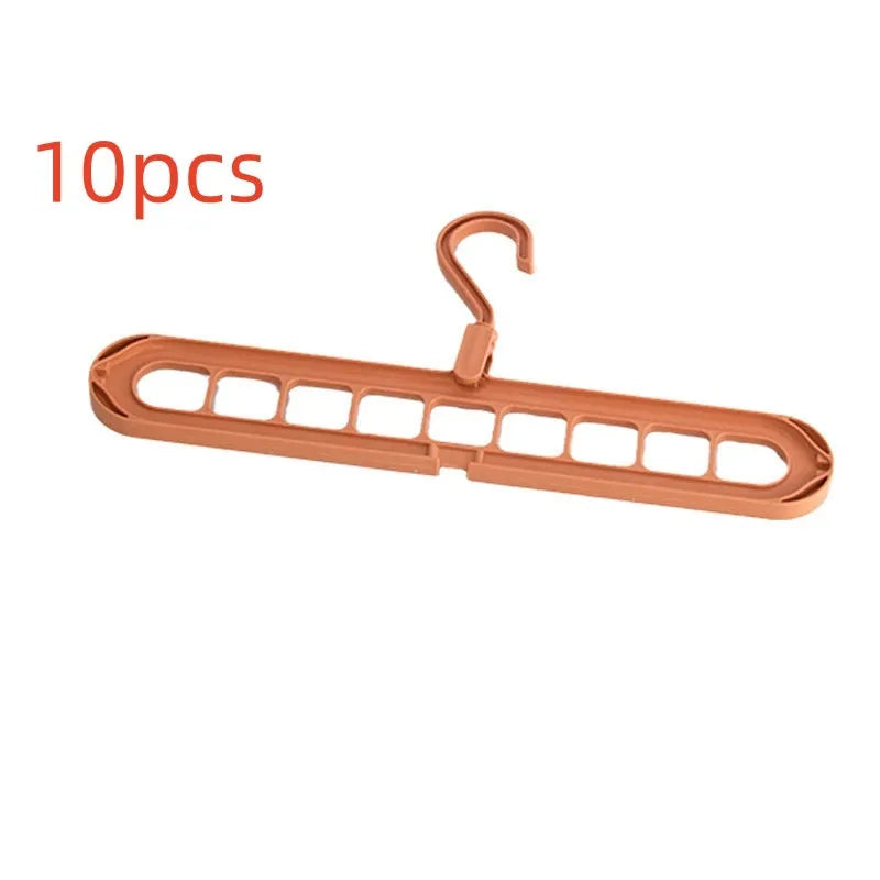 A green plastic multifunctional hanger with nine holes for trousers, shown in a folded and unfolded position.