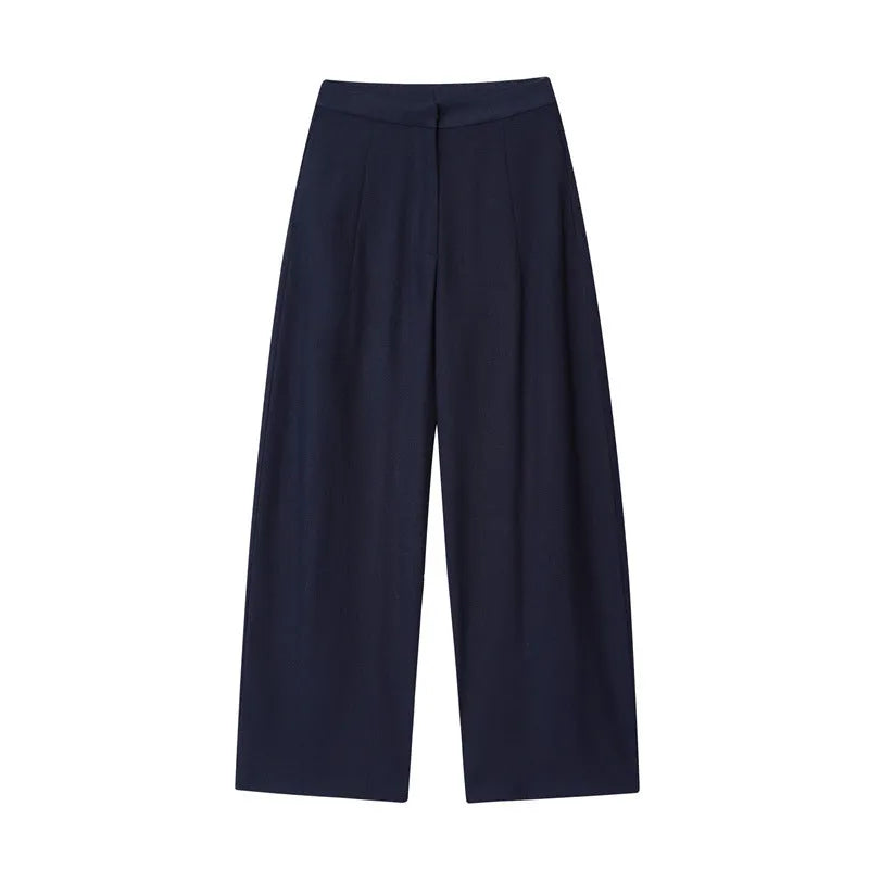 Women's linen blend co-ord set showing off-neck top with flounced sleeves and wide leg trousers.