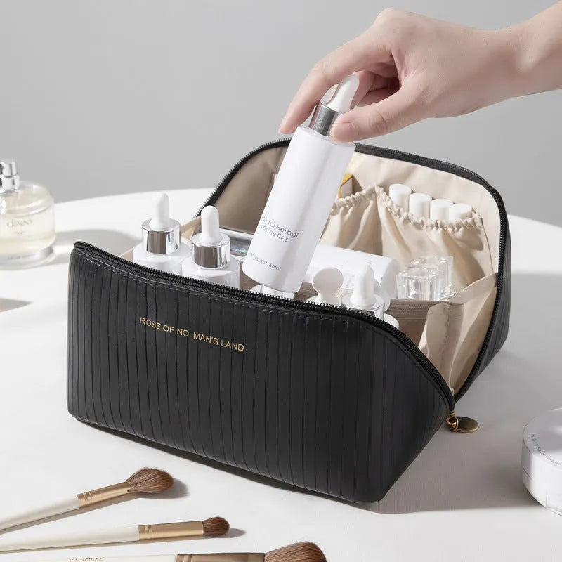 Cubic pillow makeup bag with vertical pattern in five colour options showing 22.5cm dimensions