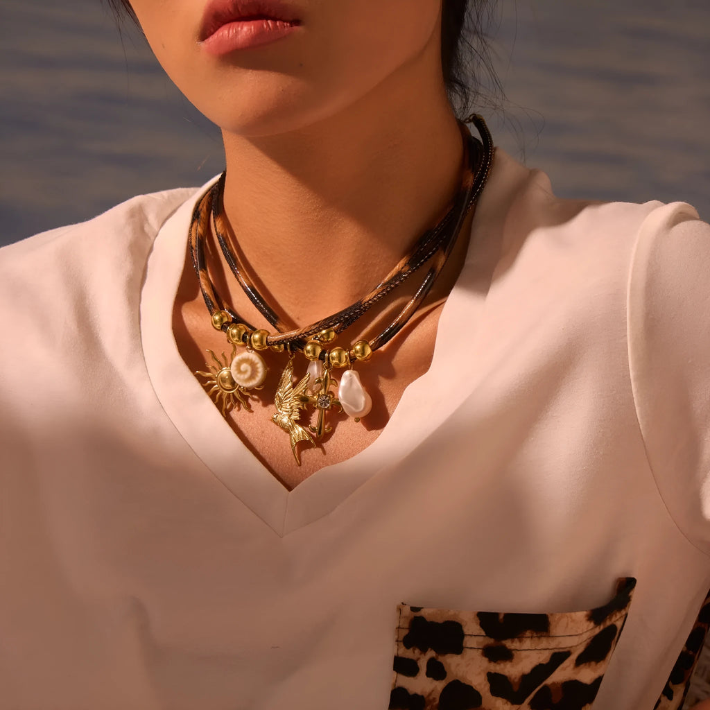 Geometric leopard pendant necklace on stainless steel chain with gold electroplated finish