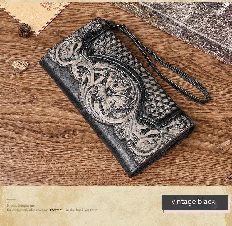 Chinese style embossed women's tri-fold wallet in genuine cowhide leather showing floral pattern detail
