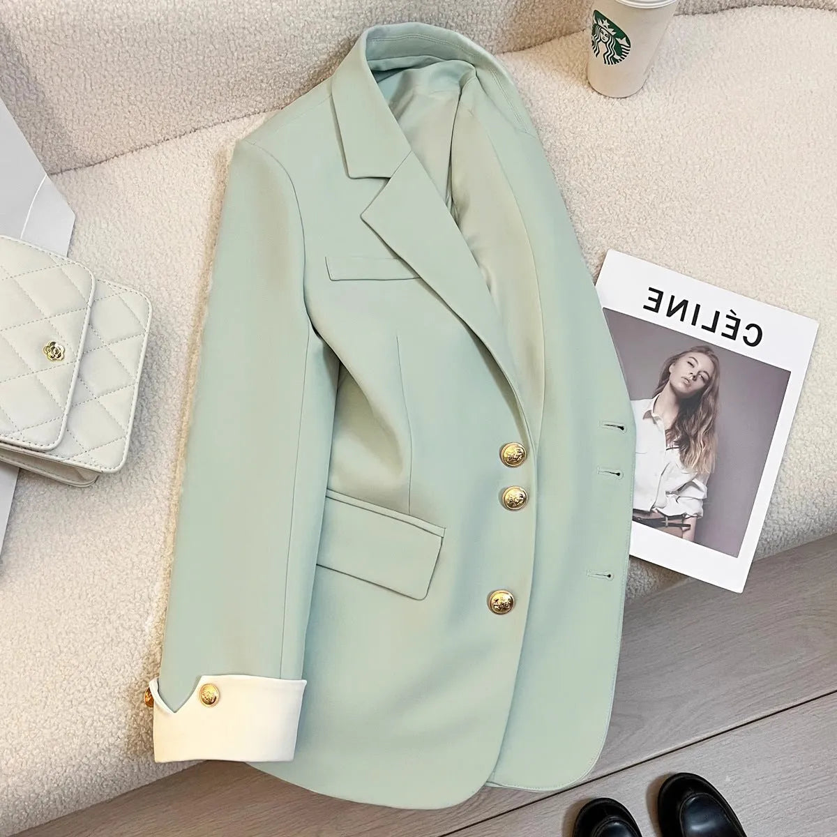 Women's Korean style loose fit polyester trench coat in milky white showing medium length and pocket details