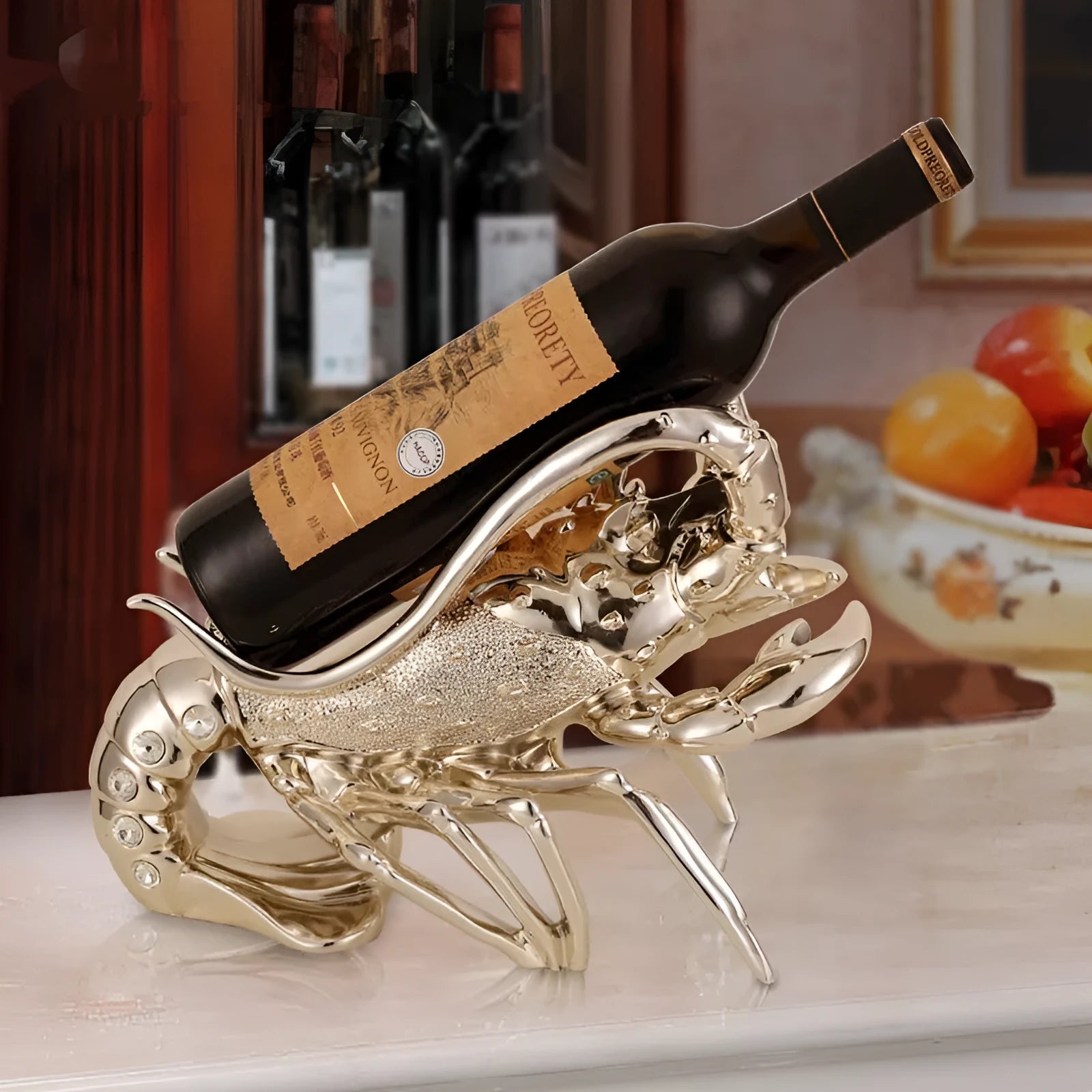 Lobster-shaped wine rack ornament in metallic finish displaying wine bottle