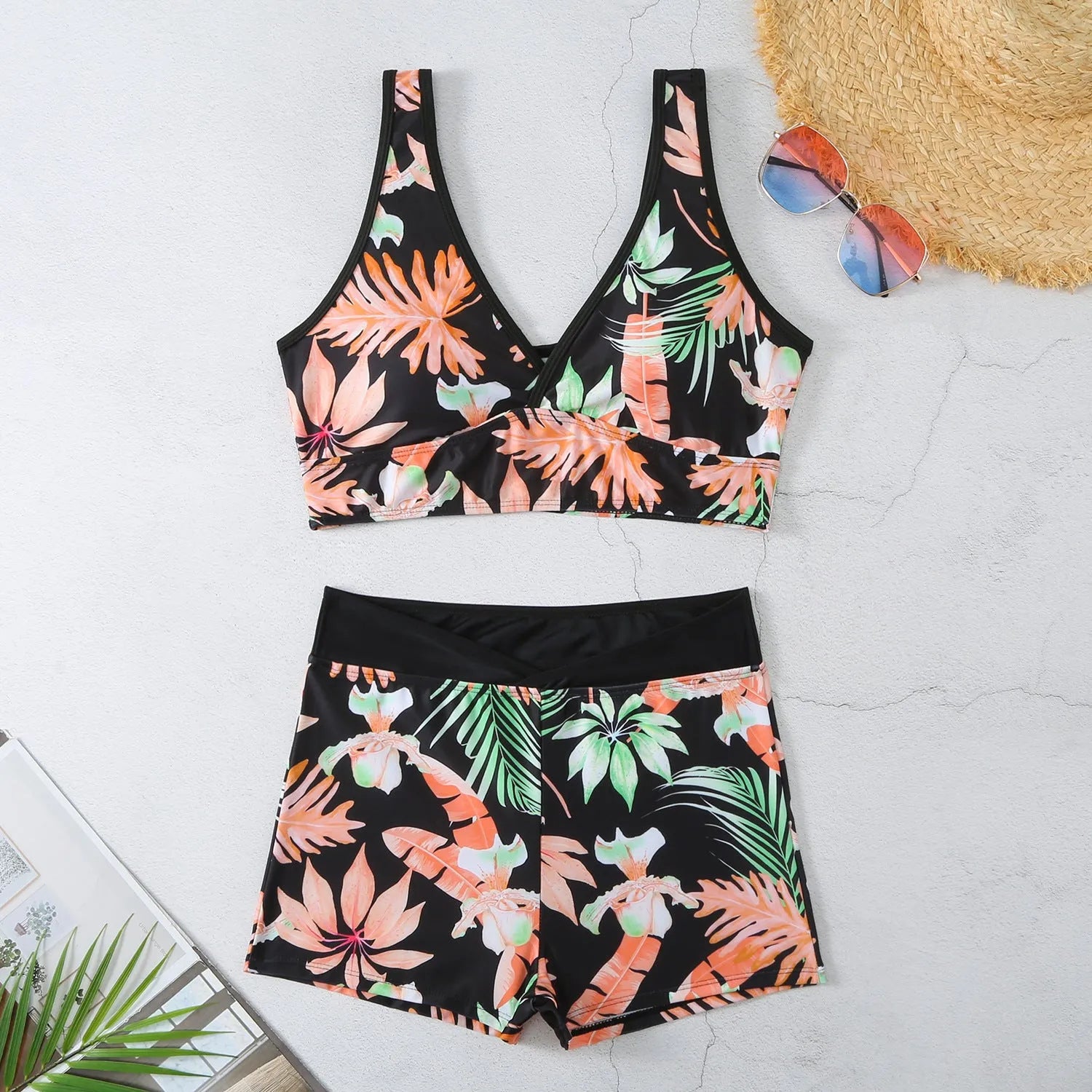 Women's two-piece swimsuit with sleeveless top and printed boxer shorts in multiple colours.